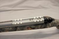 Thompson Center OMEGA In Line Blackpowder Rifle  .50 Cal  Stainless Barrel  Synthetic Camo Stock Img-5