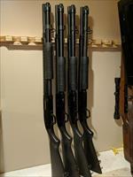 Mossberg 590 is a 12 gauge pump action shotgun with a 3 inch chamber.  Img-1