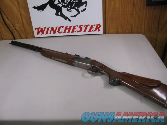 8123  Winchester Super grade 12 gauge over 222 Remington. Only 1000 ever produced
