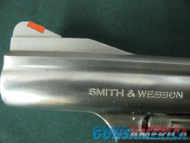 7262 Smith Wesson 66-2 Combat Magnum, 357 Mag. 4 inch barrel orange front site, square notched rear site, Pachmayr black checkerd grips,slight drap line.Nickel, all original,very excellent condition. shot very little.99% CONDITION Img-6