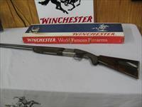 7599 Winchester 101 Pigeon 20 gauge 26 inch barrels ic/mod matching serialized Winchester box, this is the early one with dark walnut and diamond tool tipped engraved rose and scroll coin silver receiver, round knob, Winchester butt plate.  Img-1