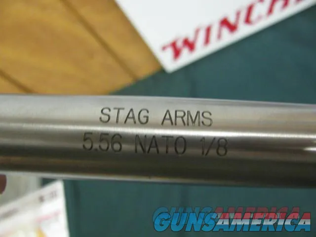 6783 Stag Arms model Stag 15 5.56223 stainless steel medium barrel 1 in 8 twist, tuned trigger, MAG PULL adjustable stock,30 rd magazine still in wrapper.Nikkon 3 x 12x40 scope. dime size group 100yds.as new with STAG PAPERS. Img-6
