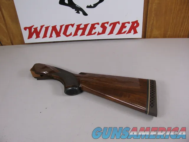 8112  Winchester 101 20 Gauge stock, wood measures 14 ½, and with the pad it measures 15 ¼, nice dark wood. Pistol grip