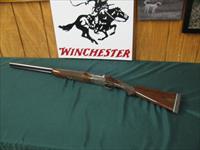 6733 Winchester 23 Pigeon XTR 12 gauge 26 barrels 3 inch chambers, vent rib, ejectors, single select trigger, beavertail, round knob, White line pad lop 14 1/4.coin silver rose and scroll receiver,opens closes tite,bores/brite/shiny. 98% co Img-1