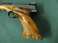 7261 Browning Medalist 22 long rifle  6.75 inch barrel. weight adapter and 3 weights, 2 blade folding screw driver, Pamplet,CASED. never fired, NEW IN CASE.vent rib, adj site, 1964-75mfg in Belgium,checkered thumb rest stock in Rosewood. no Img-5