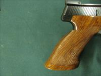 7261 Browning Medalist 22 long rifle  6.75 inch barrel. weight adapter and 3 weights, 2 blade folding screw driver, Pamplet,CASED. never fired, NEW IN CASE.vent rib, adj site, 1964-75mfg in Belgium,checkered thumb rest stock in Rosewood. no Img-9