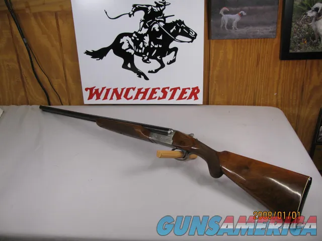 7850  Winchester 23 Pigeon XTR 20 gauge 26 inch barrels 2 3/4&3 inch chambers, ic/mod, round knob, vent rib, ejectors, Winchester butt plate, rose and scroll coin silver engraved receiver, opens closes tight, bores bright shiny, 2 white bea Img-1
