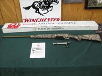 7263 Ruger American 6.5 creedmore 24 inch barrel, withvfactory muzzel brake, Go Wild Camo, bolt never put in, very hard model to find. NEW IN BOX. PAPER, low production number of these were ever mad.burnt bronze cerakote. NEW IN BOX Img-1