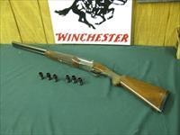 6593 Winchester 23 Pigeon XTR 12 gauge 26 inch barrels 6  flush winchokes, s, ic, m,im,f,xf, round knob, vent rib, ejectors , original Winchester butt pad, coin silver rose and scroll engraved receiver,small crack by receiver. single select Img-1