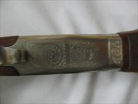 7597 Winchester 101 Pigeon XTR 28 gauge 28 barrels skeet/skeet 99% condition, BABY FRAME, rose and scroll coin silver receiver, all original, Winchester butt plate, ejectors, vent rib, 2 White beads, opens and closes tite,bores brite/shiny,