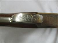 7597 Winchester 101 Pigeon XTR 28 gauge 28 barrels skeet/skeet 99% condition, BABY FRAME, rose and scroll coin silver receiver, all original, Winchester butt plate, ejectors, vent rib, 2 White beads, opens and closes tite,bores brite/shiny,