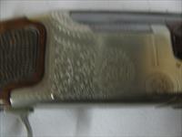 7597 Winchester 101 Pigeon XTR 28 gauge 28 barrels skeet/skeet 99% condition, BABY FRAME, rose and scroll coin silver receiver, all original, Winchester butt plate, ejectors, vent rib, 2 White beads, opens and closes tite,bores brite/shiny,