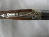 7597 Winchester 101 Pigeon XTR 28 gauge 28 barrels skeet/skeet 99% condition, BABY FRAME, rose and scroll coin silver receiver, all original, Winchester butt plate, ejectors, vent rib, 2 White beads, opens and closes tite,bores brite/shiny,