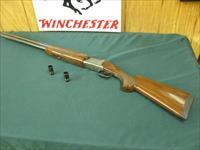 7166 Winchester 101 Lightweight 12 gauge 27 inch barrels 2 3/4&3inch chambers,ejectors, vent rib, pistol grip,Winchester butt pad,screw chokes, ic, mod 2 xfull, coins silver receiver with pheasants, quail grouse, black diamonds in stock. Img-1