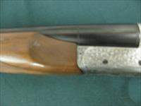 7183 Ithaca 280 E 12 gauge 28 inch barrel 2 3/4 chamber, mod/full raised rib, single select trigger, ejectors, pistol grip with cap. all original white line pad 14 1/4 lop, scalloped receiver, rose/scroll coin silver engraved receiver, 97+% Img-4
