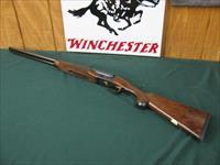 6514 Winchester 23 Classic 20 gauge 2 3/4 & 3inch chambers, ic/mod, pistol grip, vent rib ejectors, all original 99.9% AA++Fancy Walnut. Gold raised relief pheasant on bottom of receiver.Ebony insert in forend, bores brite/shiny opens close Img-1