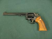 7301 Smith Wesson 14-4 38 special 8 3/8 inch barrel, adjustable rear site, medallion grips of walnut.NOt a mark on it. As new in box, papers tool and correct box. what a collectors piece. Img-3