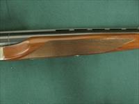 6940 Winchester model Pigeon XTR 12 gauge 27 barrels, 6 winchokes, sk,ic,mod,im,f,xf,2 pouches, wrench, keys, all complete and original 98% condition, Winchester case, Winchester butt pad, rose and scroll coin silver engraved receiver. this Img-14