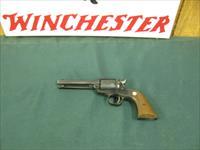 6884  MINT RUGER BEARCAT 22 caliber SINGLE ACTION 4 REVOLVER Serial number 91-48640.EARLY ONE WITH STEEL FRAME- new condition with 100% original blue overall. Factory wood grip panels. No drag line. Does not appear ever shot. Mint screws.  Img-1