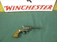 6884  MINT RUGER BEARCAT 22 caliber SINGLE ACTION 4 REVOLVER Serial number 91-48640.EARLY ONE WITH STEEL FRAME- new condition with 100% original blue overall. Factory wood grip panels. No drag line. Does not appear ever shot. Mint screws.  Img-2