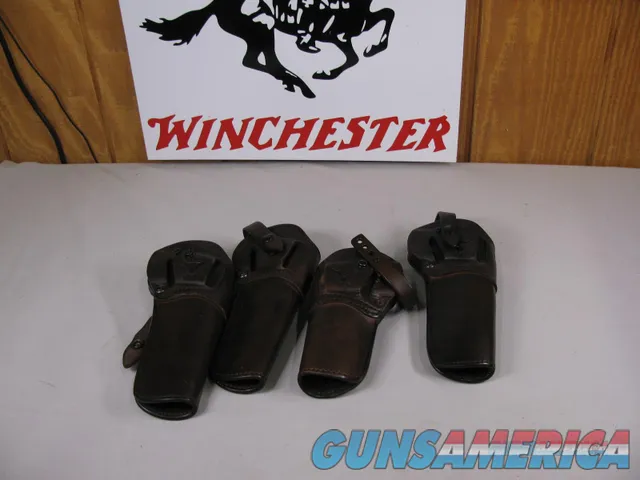 7871  4 Leather colt revolver holsters. Snap closure, Like new
