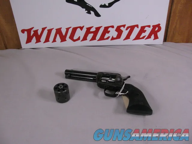 8023 Colt Peacemaker 22LR./WMR, 4.4” barrel, MFG 1974 with dual cylinders. Black eagle grips excellent condition 