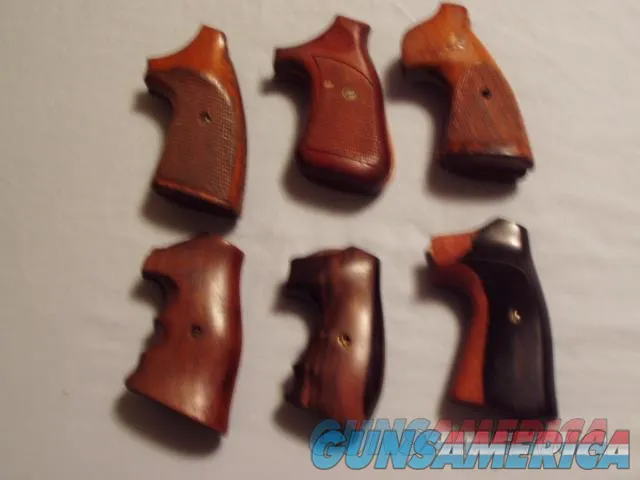 USED SIX (6) PAIRS OF S&W, COLT, MISC REVOLVER TARGET GRIPS